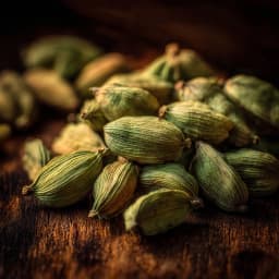 Green cardamom pods with textured shells