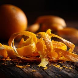 Bright tangerine zest curled into fine ribbons